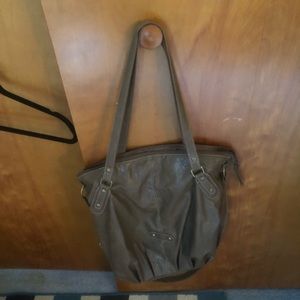 Dark tan tote with grommet details